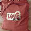 Tote bag personnalisé Love is Love Noir et Or sur sac Rouille
